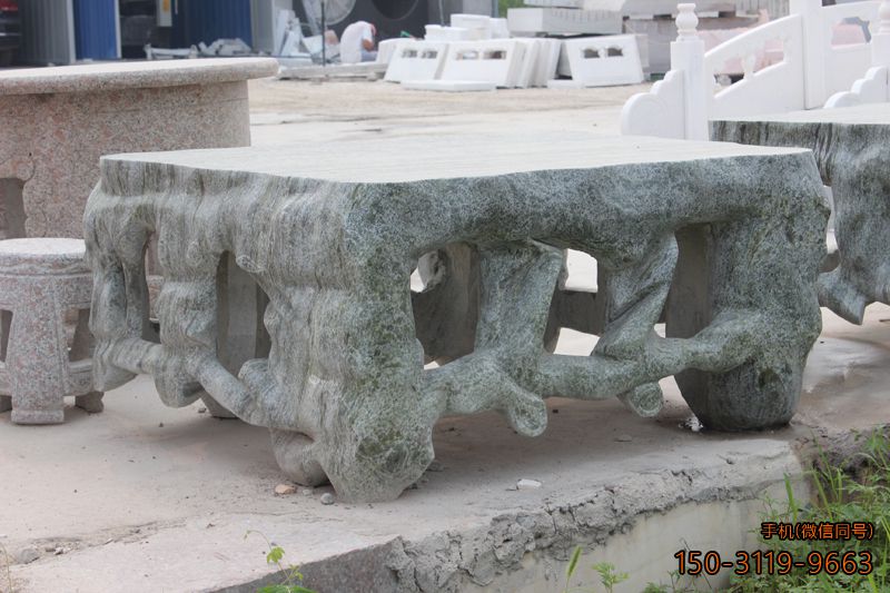 青石異形石桌_園林創(chuàng )意桌子雕塑